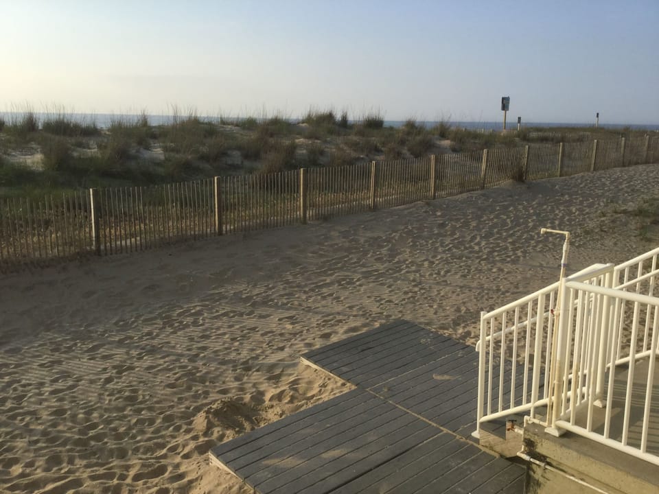 4 steps and toes in the sand onto the Little Beach, a private sandy back yard.