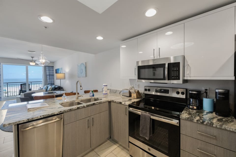 Kitchen, fully stocked with cooking/eating utensils