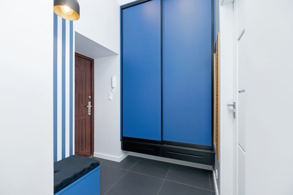 A detailed look at the entrance hallway with stylish paneling and modern lighting.
