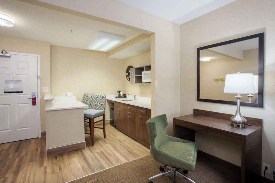 Desk, laptop workspace, blackout drapes, iron/ironing board