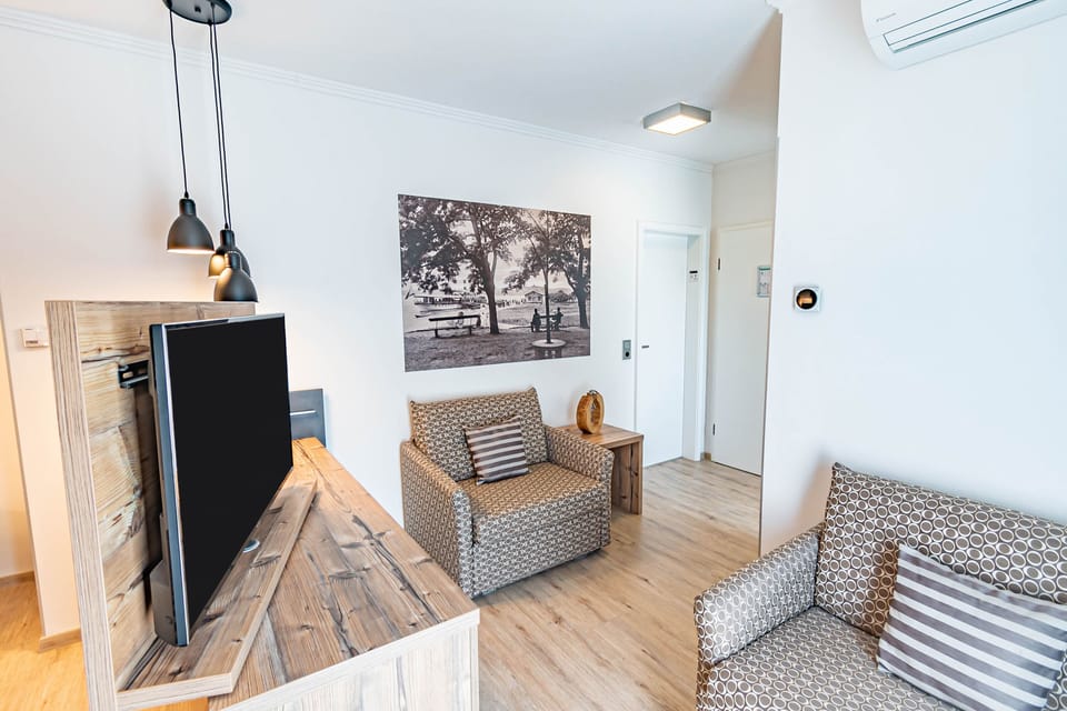 Junior Suite, Balcony, Garden View | Living area | LCD TV