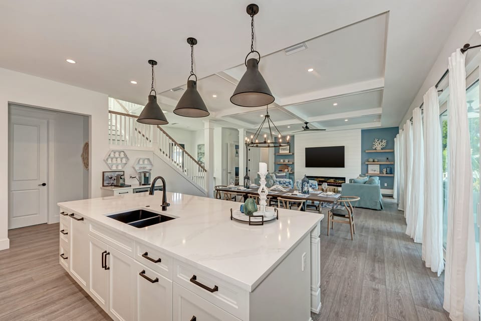 View from kitchen island to the dining and living room