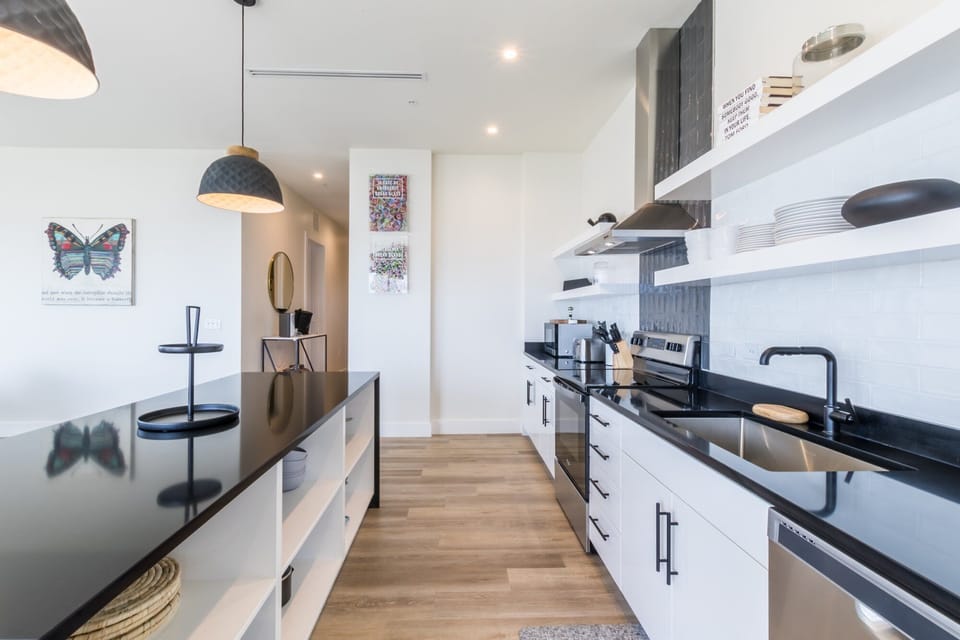 Spacious kitchen equipped with modern appliances and cooking basics to make you favorite meals!