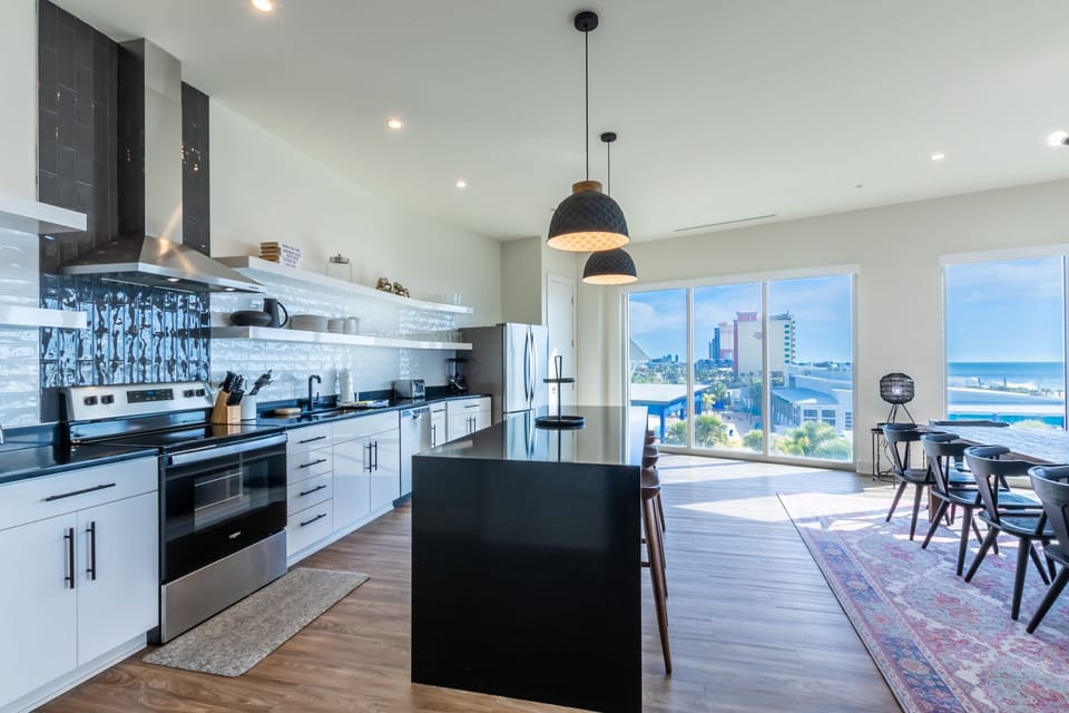 Spacious kitchen equipped with modern appliances and cooking basics to make you favorite meals!