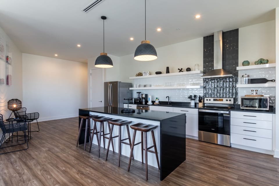 Spacious kitchen equipped with modern appliances and cooking basics to make you favorite meals!
