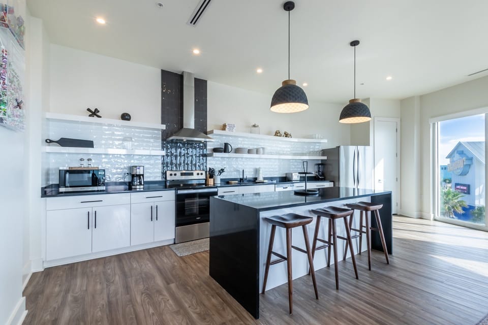 Spacious kitchen equipped with modern appliances and cooking basics to make you favorite meals!