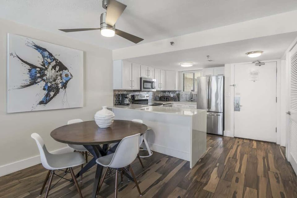 Gourmet kitchen equipped with blender, coffee machine, lots of cookware, and enough dishes and dining utensils for everyone.