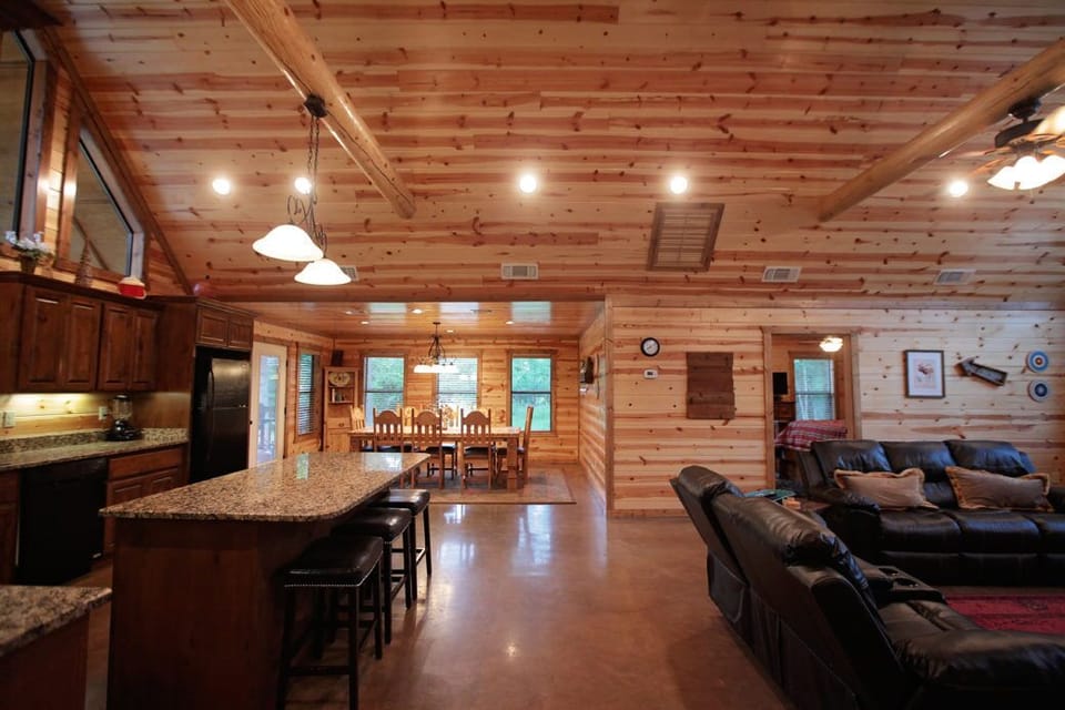 Spacious cabin kitchen and living area made for gathering, cooking, and relaxing together