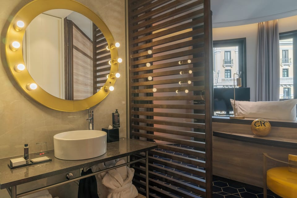 Deluxe Grand View | Bathroom | Shower, designer toiletries, hair dryer, bathrobes