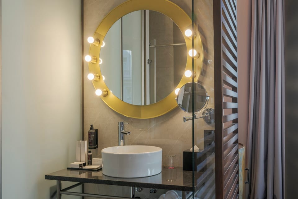 Shower, designer toiletries, hair dryer, bathrobes