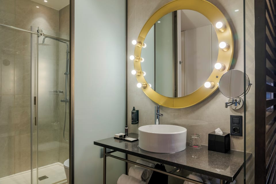 Premium Balcony | Bathroom | Shower, designer toiletries, hair dryer, bathrobes