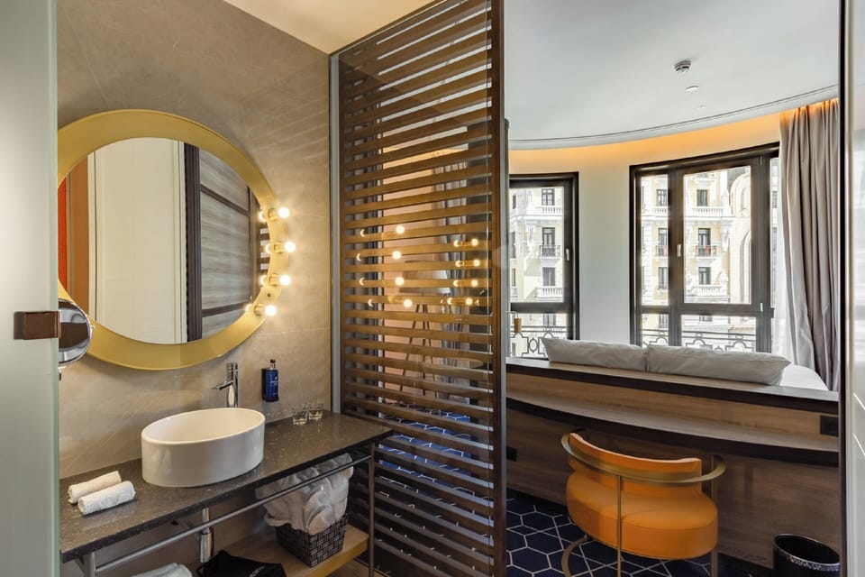 Shower, designer toiletries, hair dryer, bathrobes