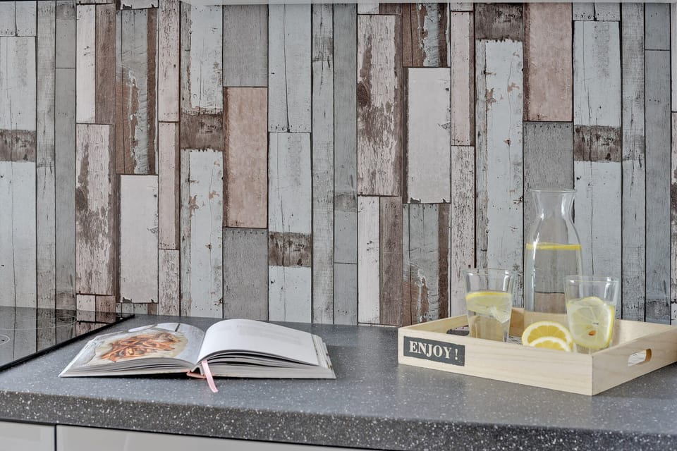 A sleek gray marble countertop with a coffee maker and a fresh cup of coffee, adding a touch of comfort to the modern design.