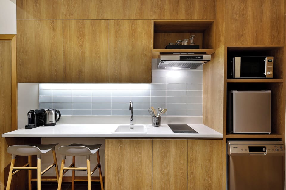 Mini-fridge, stovetop, espresso maker, coffee/tea maker