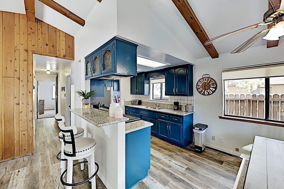 Keep the chef company at the bar complete with 2 barstools.