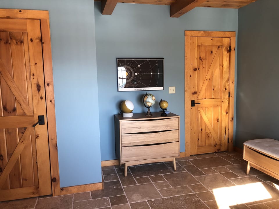 Dresser, built-in closet and storage bench offer space for your luggage. 