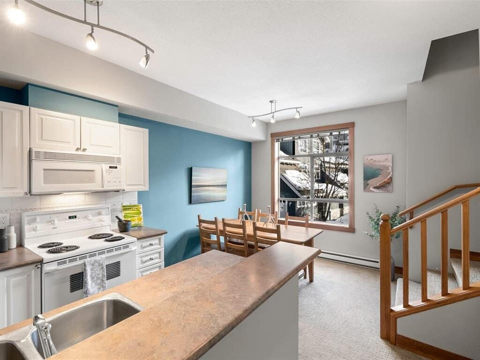 Kitchen along with a dinner table for 6