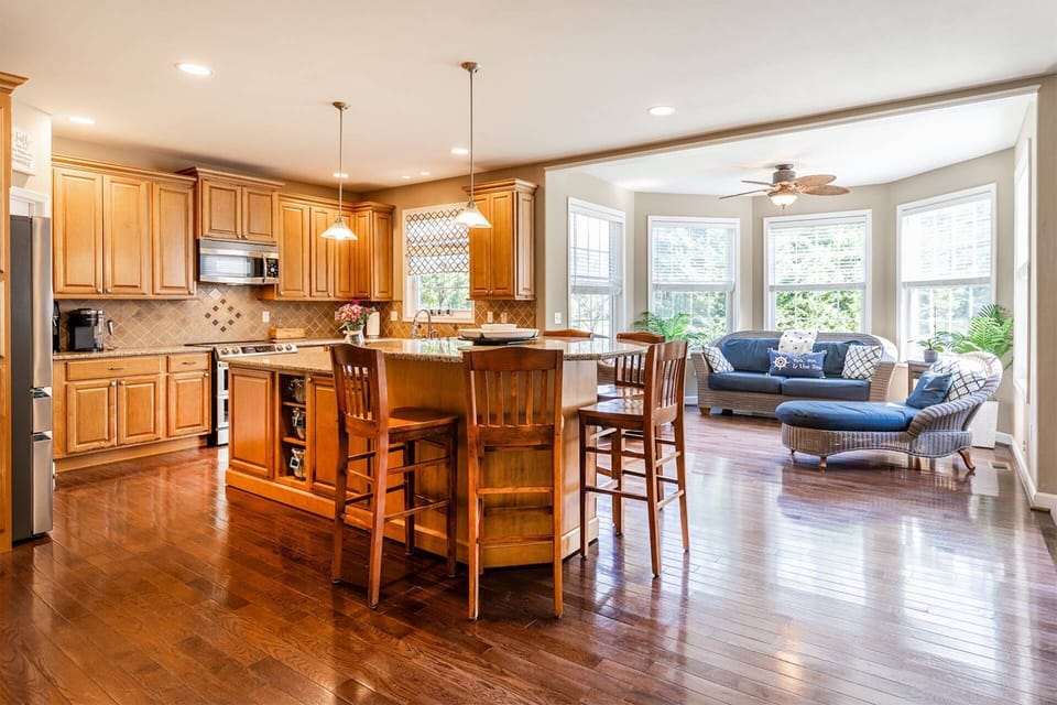 Full gourmet kitchen with breakfast bar and sunroom