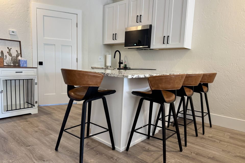 Updated kitchen with comfy barstools