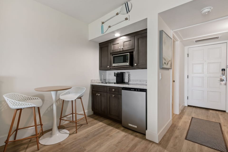 Kitchenette with Bistro Table, Mini Fridge, Microwave, and Coffee Maker