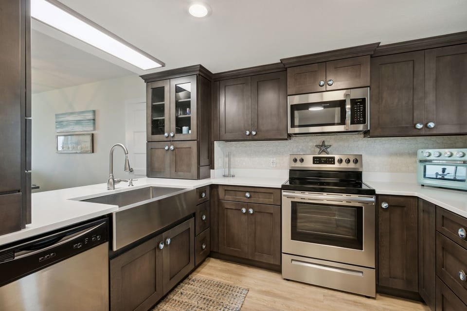 Totally Remodeled and Fully Equipped Kitchen with Stainless Steel Appliances, Beautiful Cabinetry, and Stunning Granite Countertops