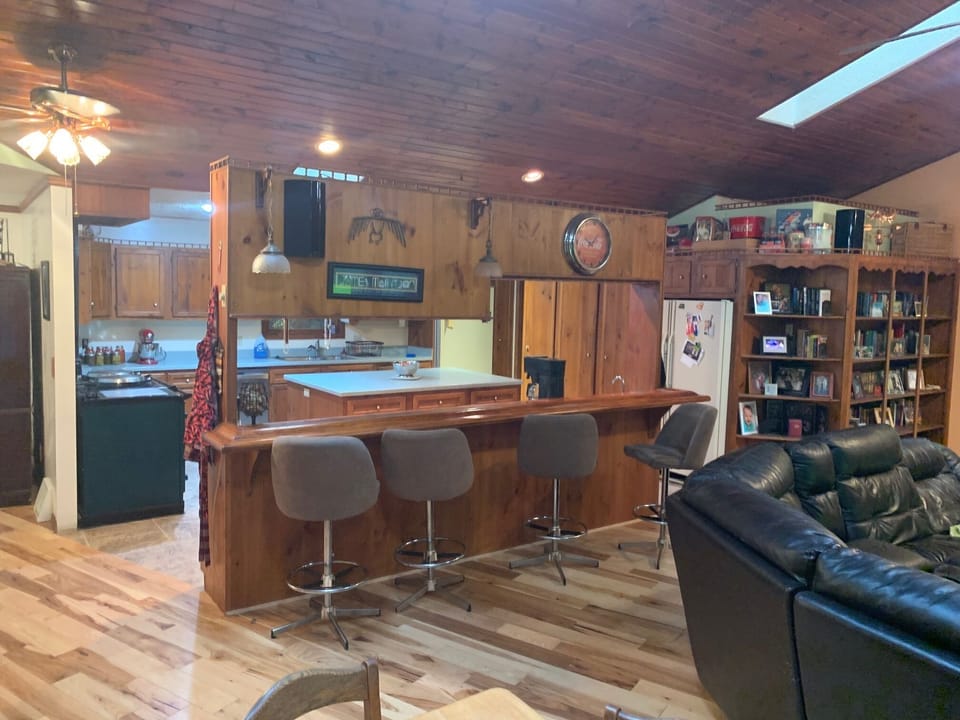 Great Room allows for social gatherings in comfort.  You cab see the bar here.