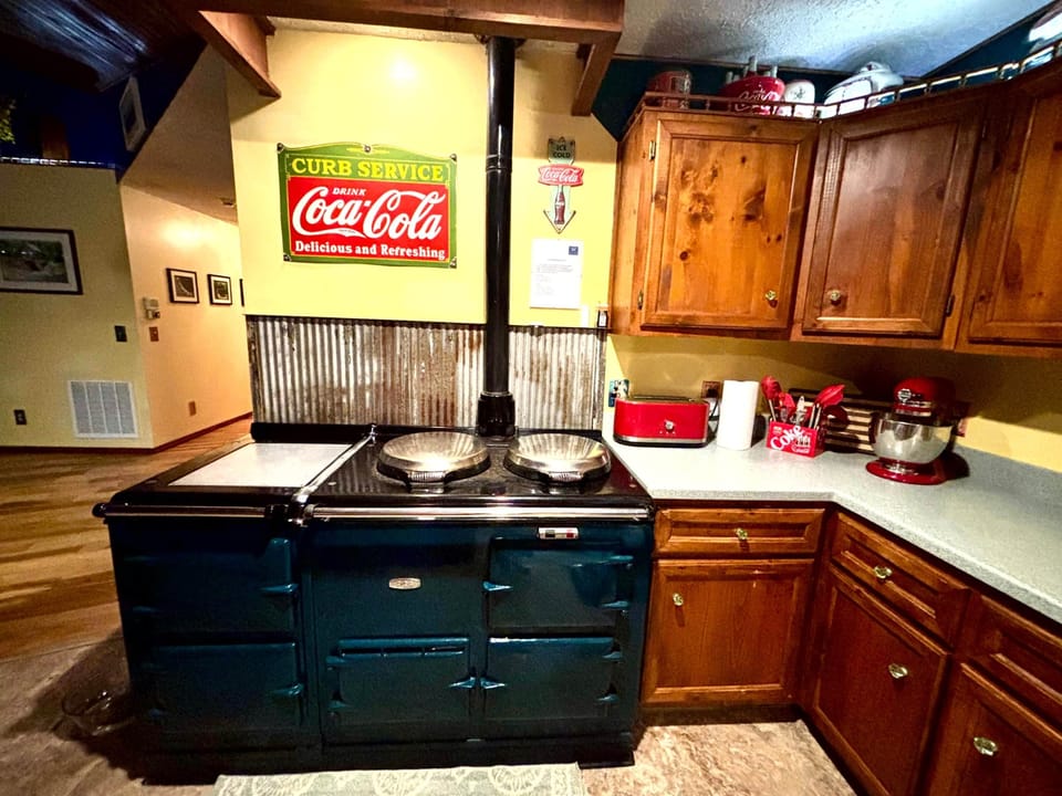 Coca-Cola themed kitchen with AGA Stove and its 4 ovens.