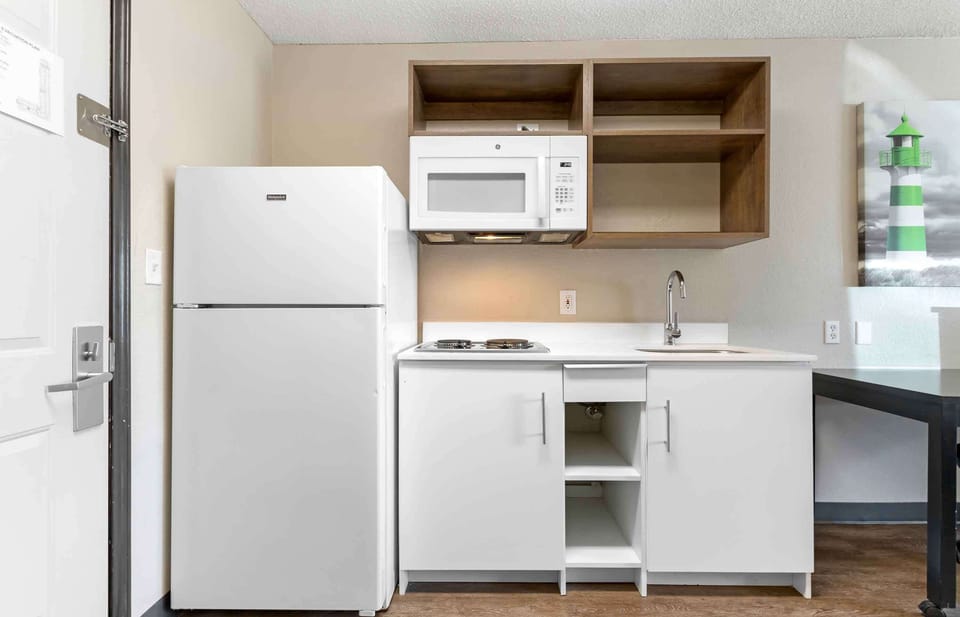 Studio, 1 Queen Bed, Non Smoking | Private kitchen | Full-size fridge, microwave, stovetop, coffee/tea maker
