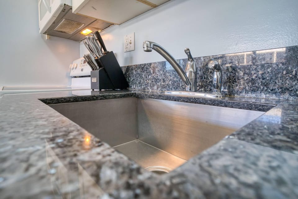 Large stainless steel sink in kitchen.