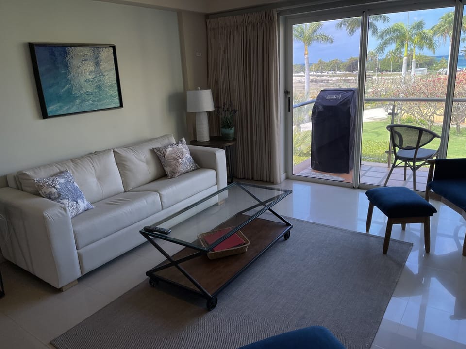 Updated living room with ocean views and 50” TV.