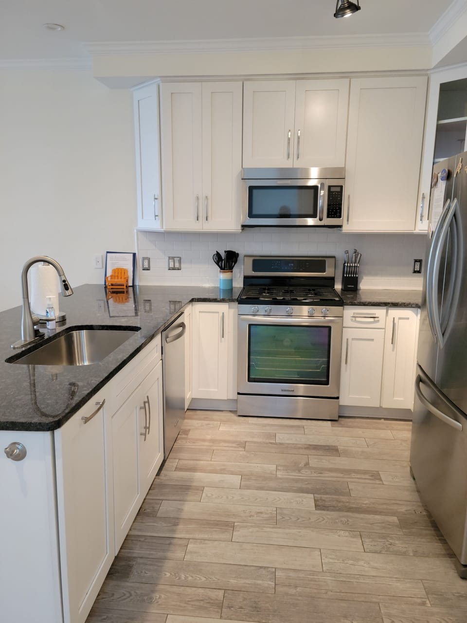Updated kitchen with stainless steel appliances. 