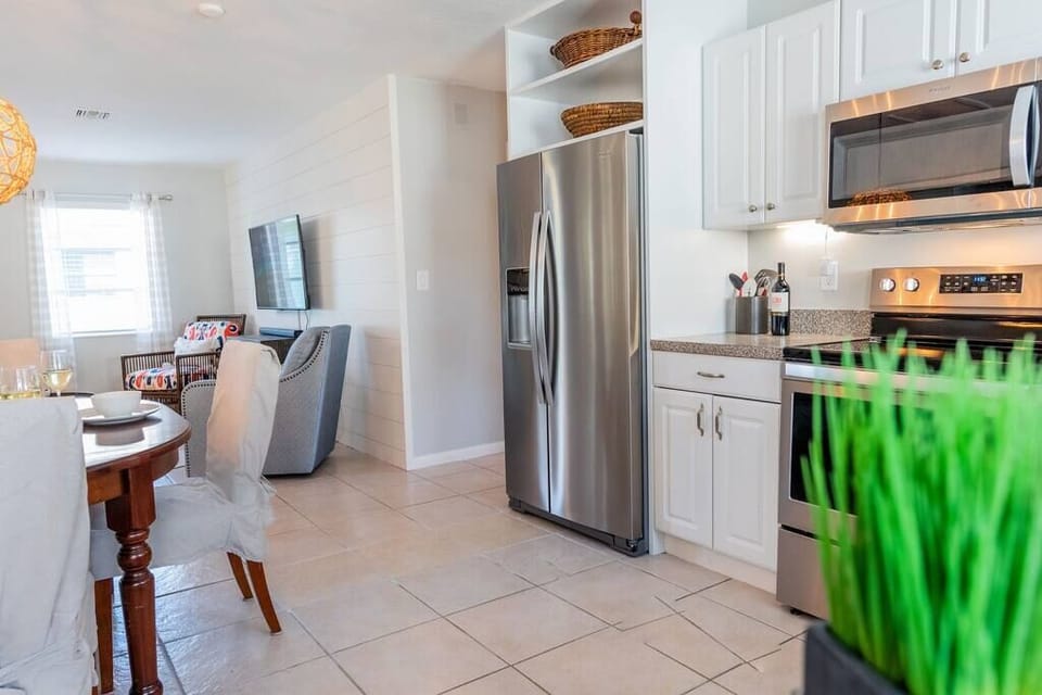 Open floor plan of kitchen to dining room to living room