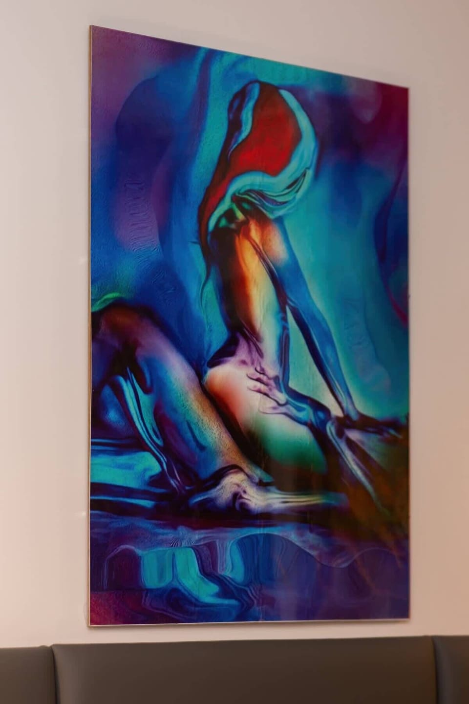 A colorful painting featuring abstract designs, adding a splash of personality to the space.