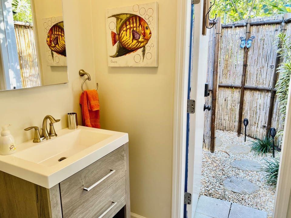 Shower attached to bathroom.