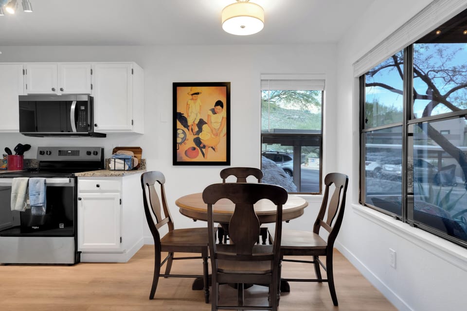 Bright dining area with mountain views next to fully equipped kitchen