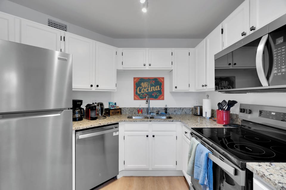 Fully equipped kitchen with modern appliances and charming Southwest style