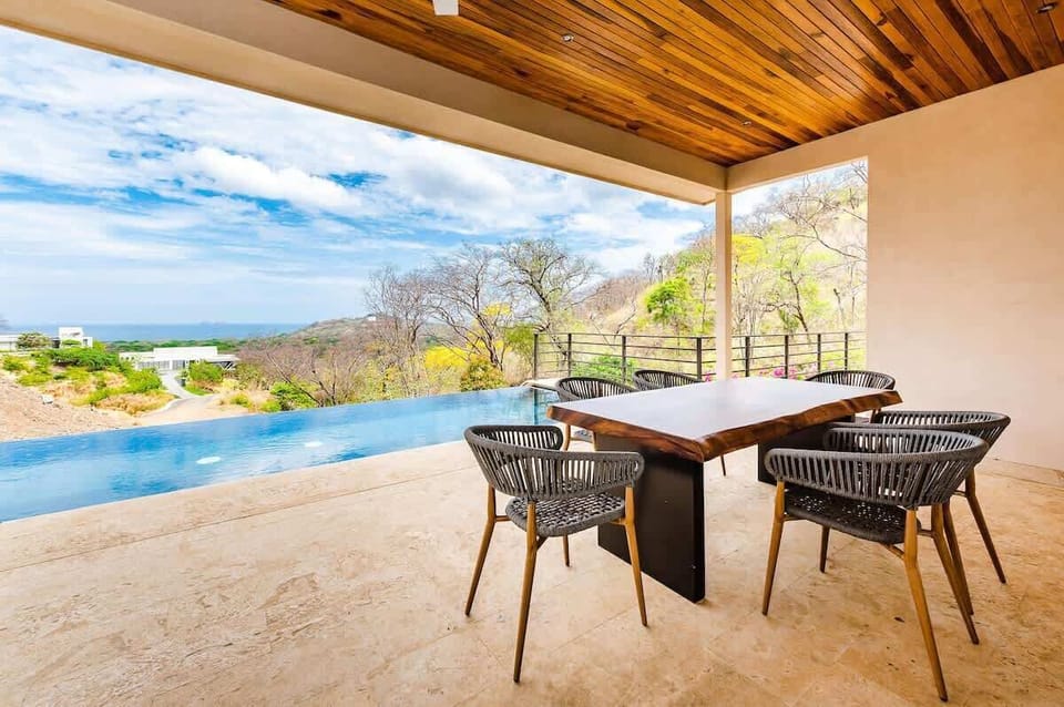 Outdoor dining area, poolside, ocean views