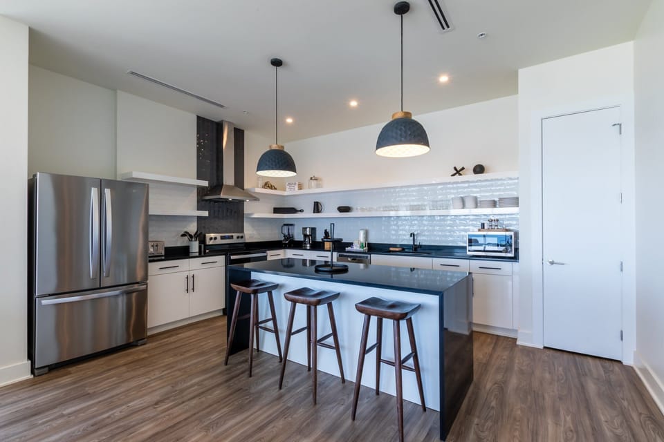 Spacious kitchen equipped with modern appliances and cooking basics to make you favorite meals!
