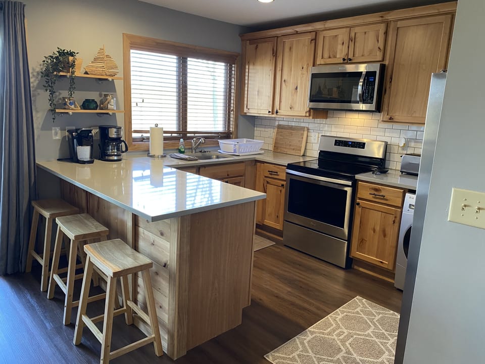 Cute kitchen is fully stocked with amenities you need to enjoy a great meal! 