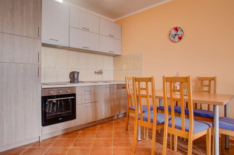 Next to it is open plan kitchen, with modern amenities.