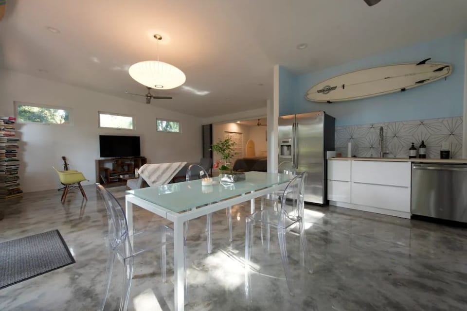 Open concept of living, dining and kitchen with high ceilings