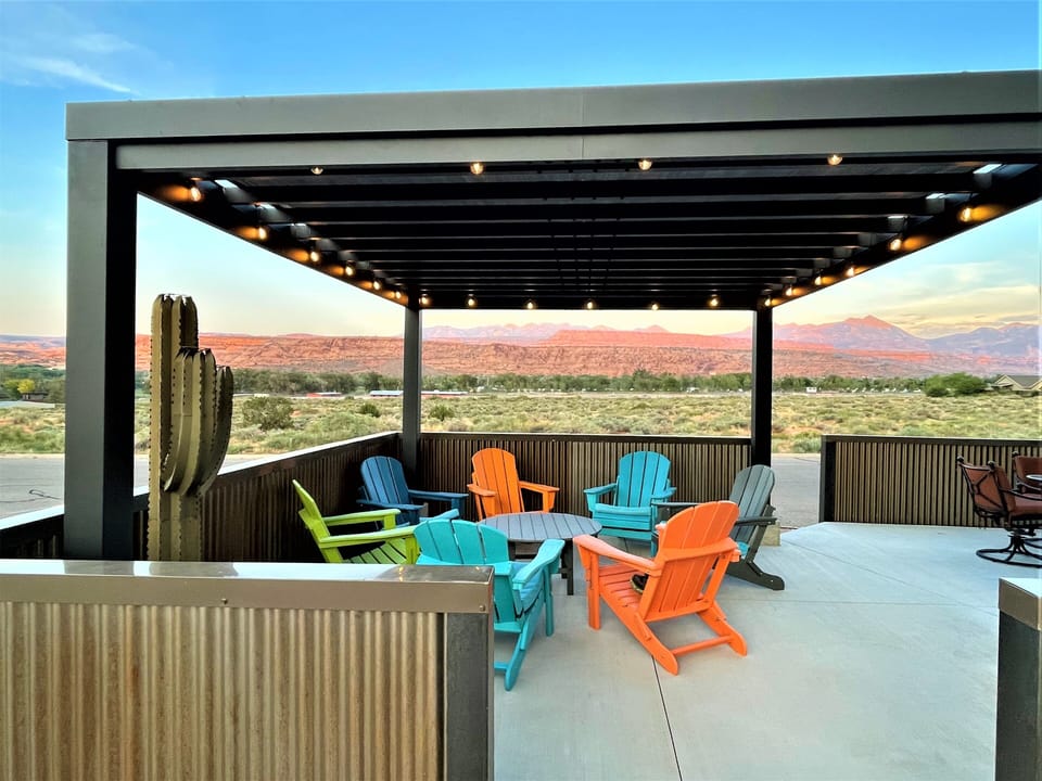 Covered seating on large patio with beautiful view of La Sal. mountains