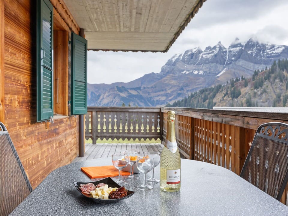 Table, Property, Tableware, Sky, Furniture, Building, Cloud, Wood, Fence, Mountain