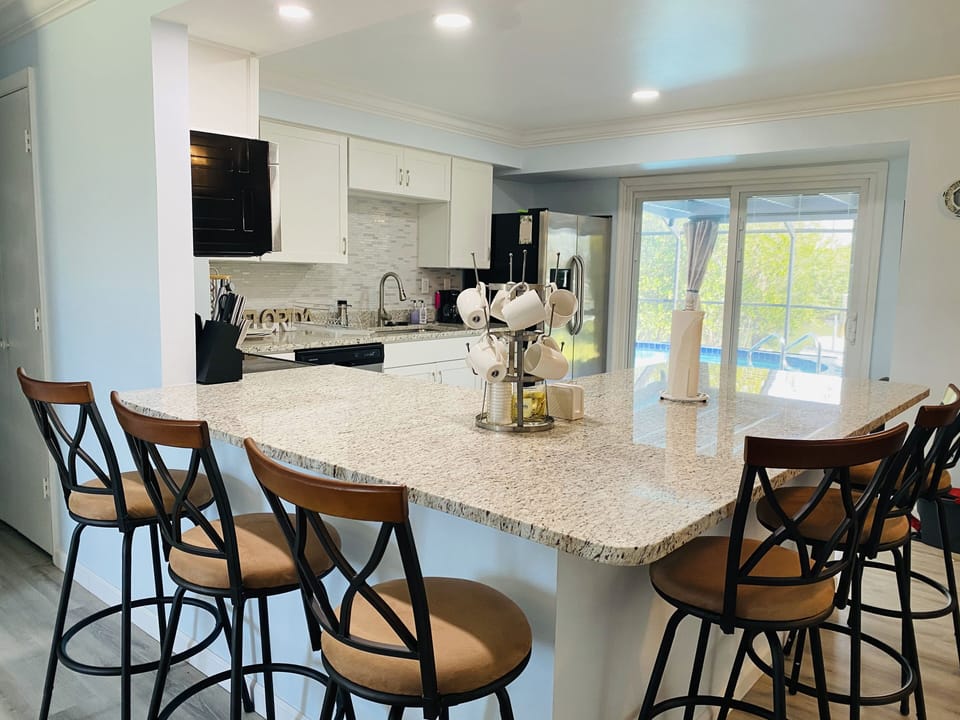 Kitchen area with full view of pool.
