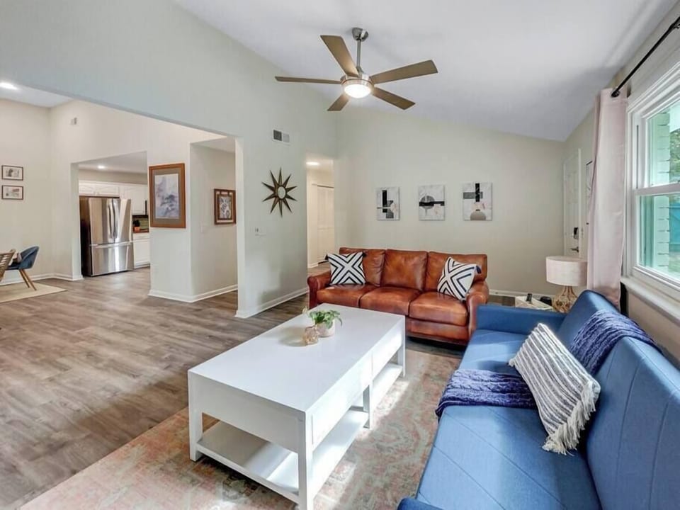 Living room opening up to dining and kitchen. 