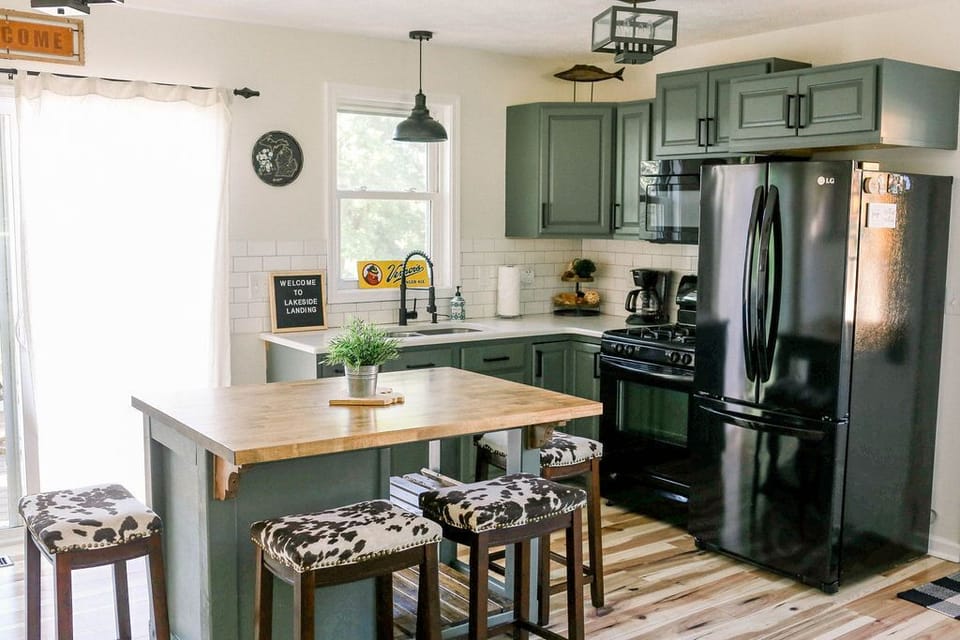 Our tiny Kitchen features a compact design that doesn’t skimp on functionality. Equipped with a microwave, full-size stove, and full-size fridge, this space efficiently meets all your culinary needs. Enjoy meals at the island which seats four.