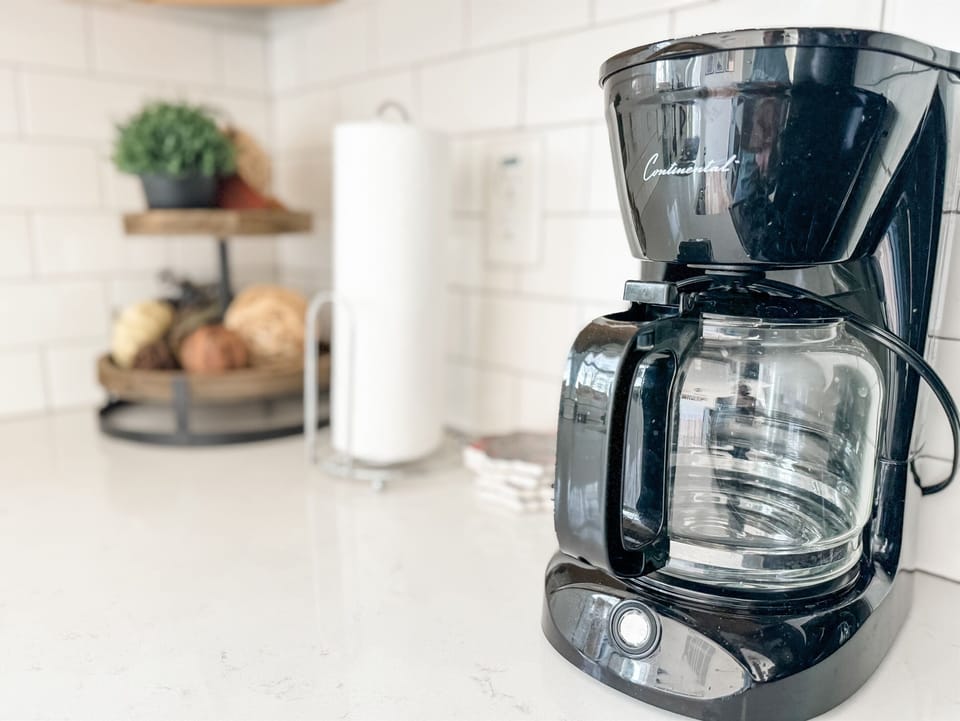 Kick start your day with a fresh brew from our drip coffee maker, complete with complimentary coffee and creamer provided for your perfect morning.