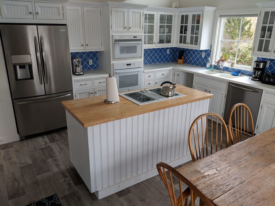 Kitchen (door to side deck and grill on other side of table)