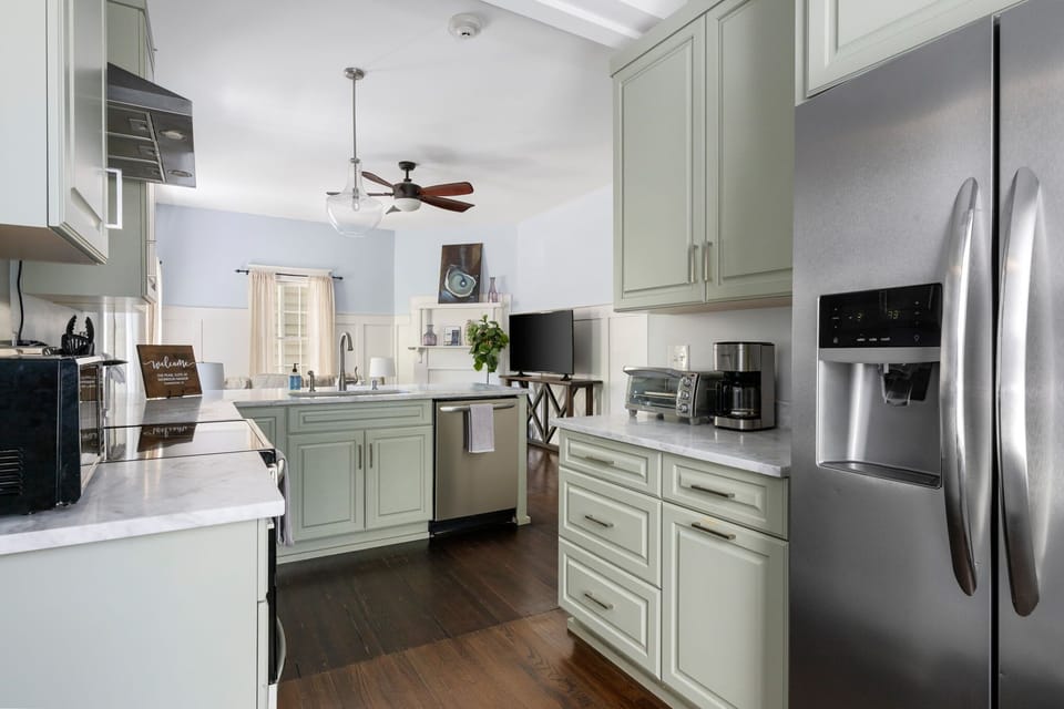 Modern kitchen with stainless steel appliances for all your cooking needs.