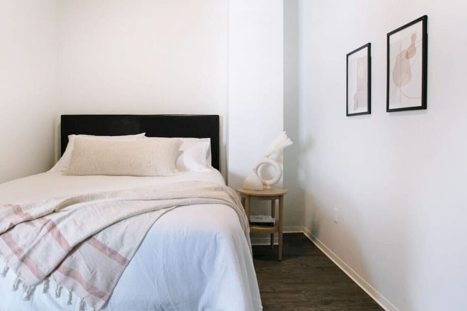 Soft linens and timeless design for a boutique-hotel feel.